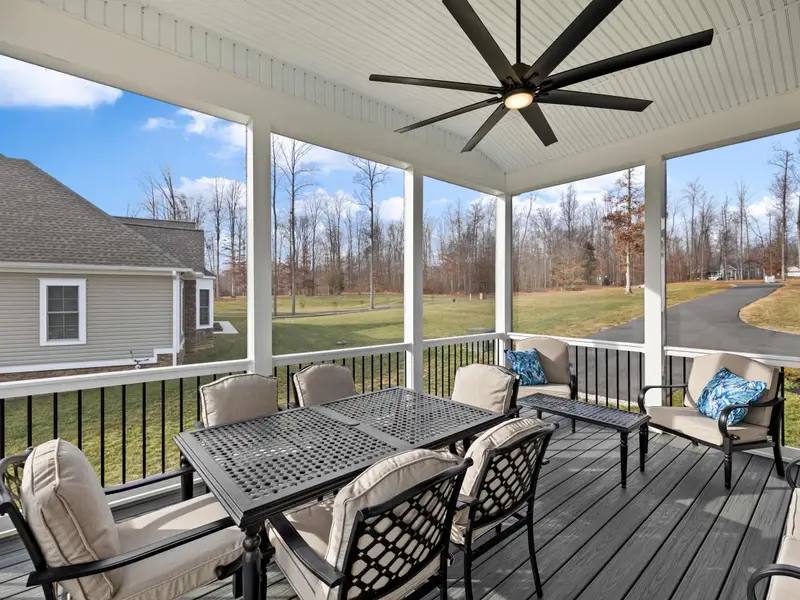 Deck - A shaded spot on the covered section, with ceiling fan and seating for morning coffee or an afternoon drink.