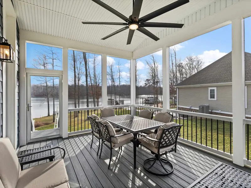 Deck - A covered area with outdoor dining table, ceiling fan, and a lake breeze that makes every meal better.