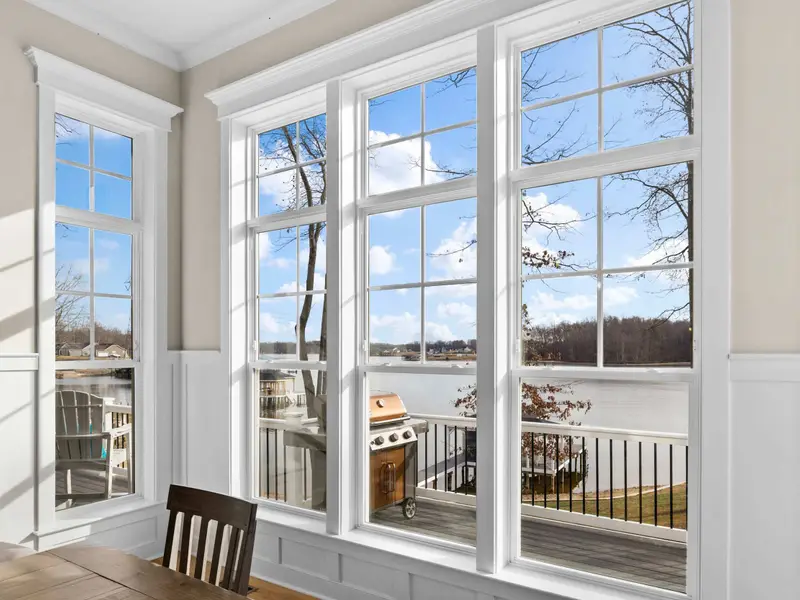 Dining Room - Floor-to-ceiling windows bring the lake right to the table, making every meal feel lakeside.