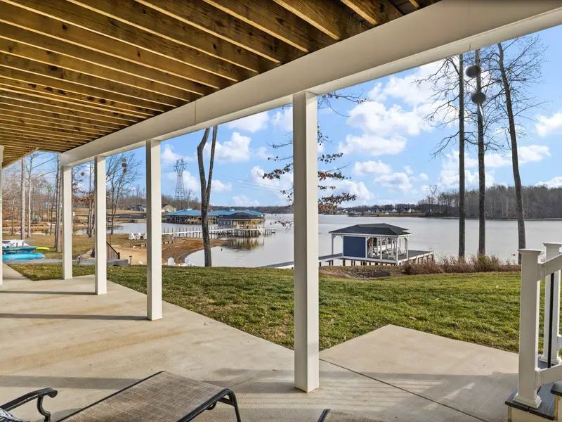 Lower Patio - The covered patio under the main deck opens directly to the lawn and the path to the boathouse, cool shade all afternoon.
