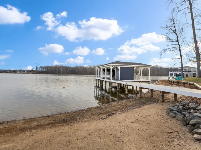 Boathouse - The boathouse structure from the shore, with open water stretching beyond.