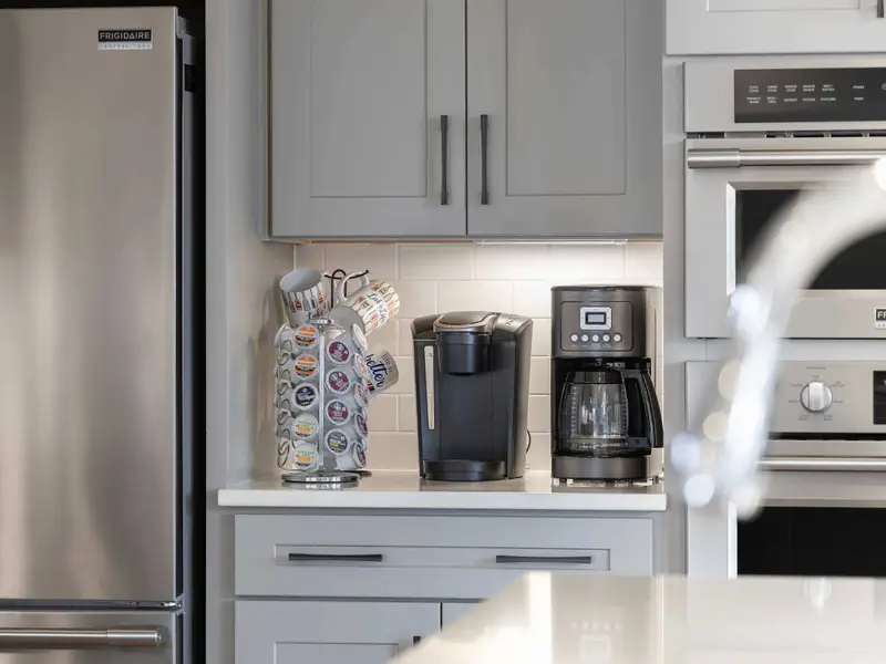Kitchen - A dedicated coffee station with drip maker, Keurig, and k-cup storage keeps everyone fueled for the day ahead.