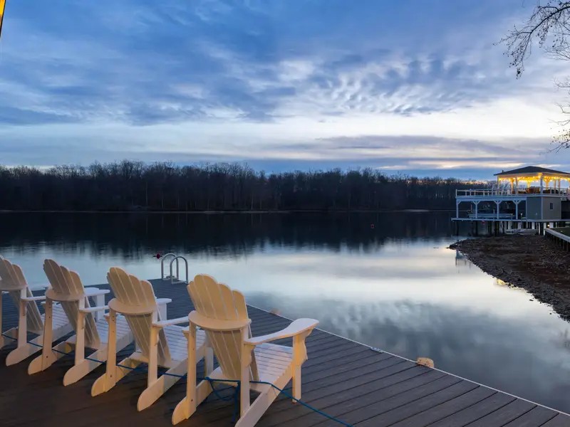 Boathouse - Adirondack chairs on the dock at blue hour, the quiet cove and last light making this the best seat in the house.