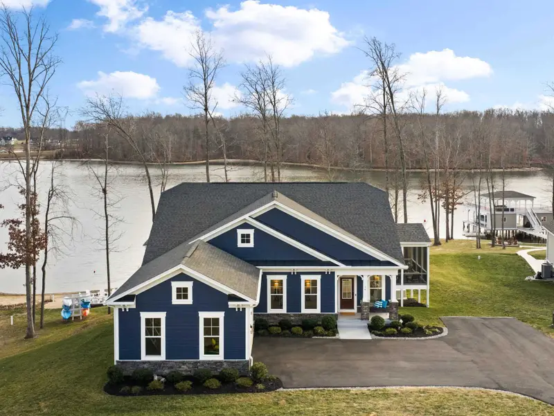 Boathouse - Aerial view of the property showing the boathouse position over the water with the house above on the hill.