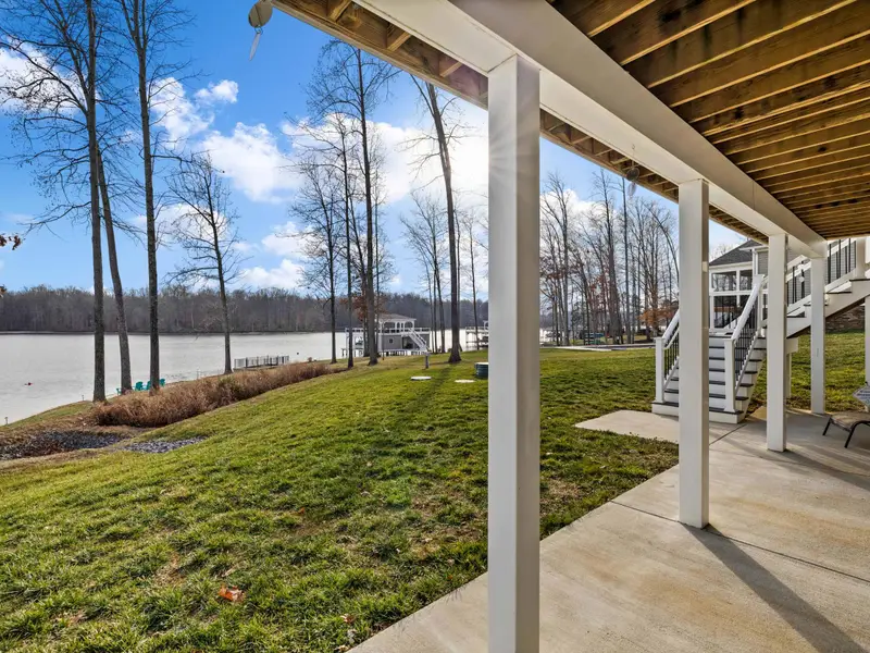 Lower Patio - Shaded and open to the lawn, the covered lower patio is the quiet level between the house and the lake.