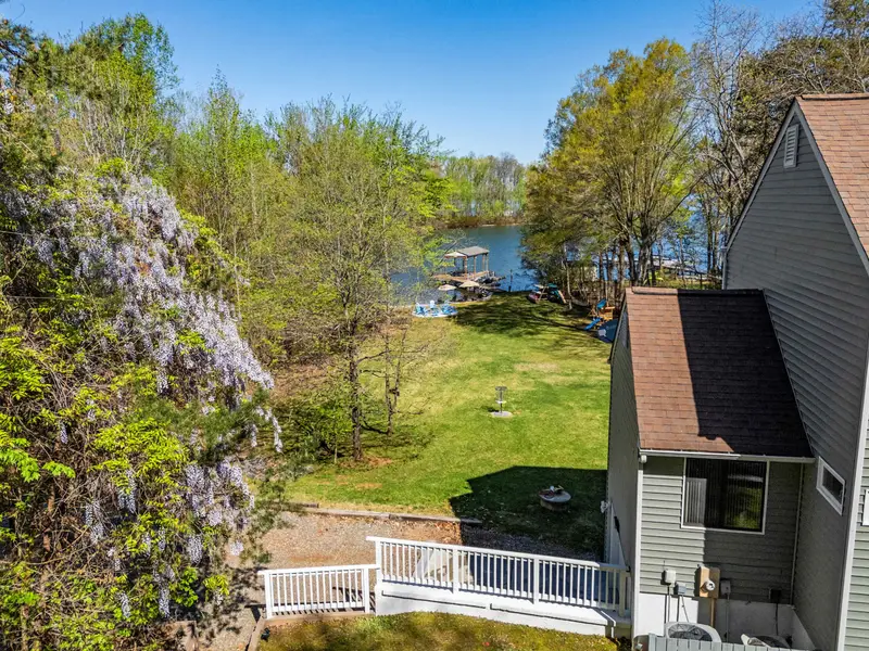 Wooded Sanctuary: Experience the best of Virginia's nature with mature trees and blue waters.