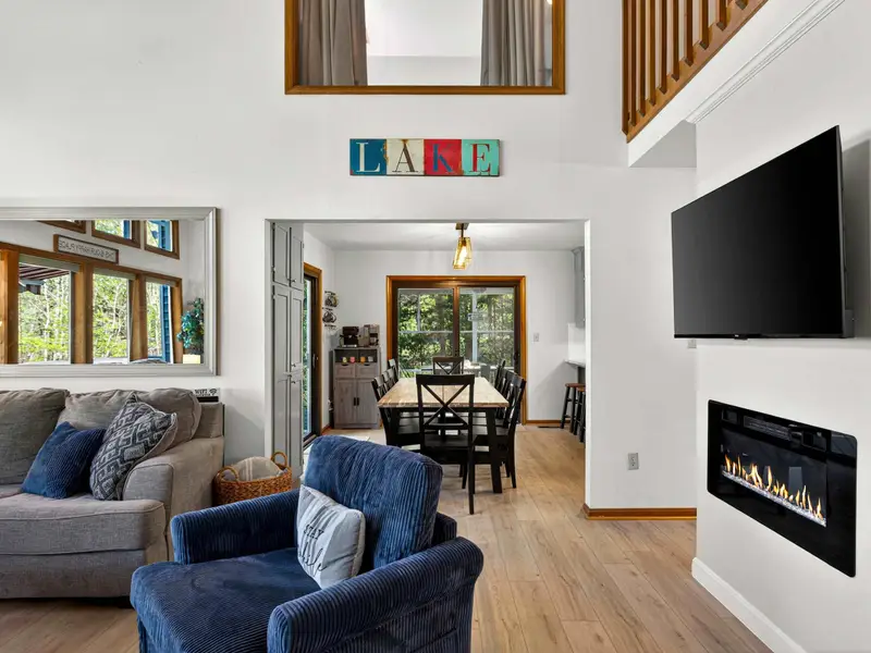 The Heart of the Home: Looking across the living space toward the dining and kitchen areas.