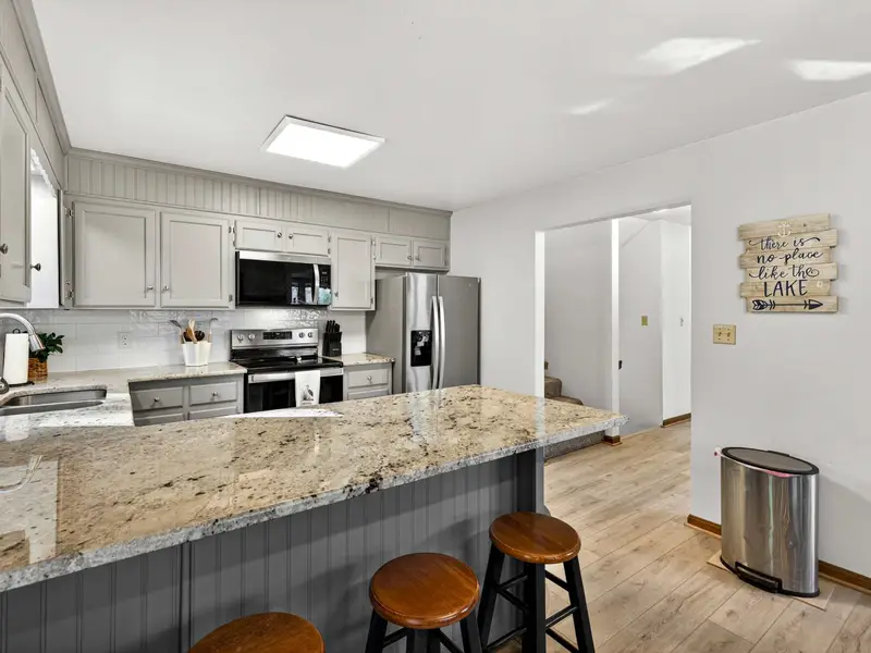 Premium Finishes: Granite counters and stainless steel appliances throughout.
