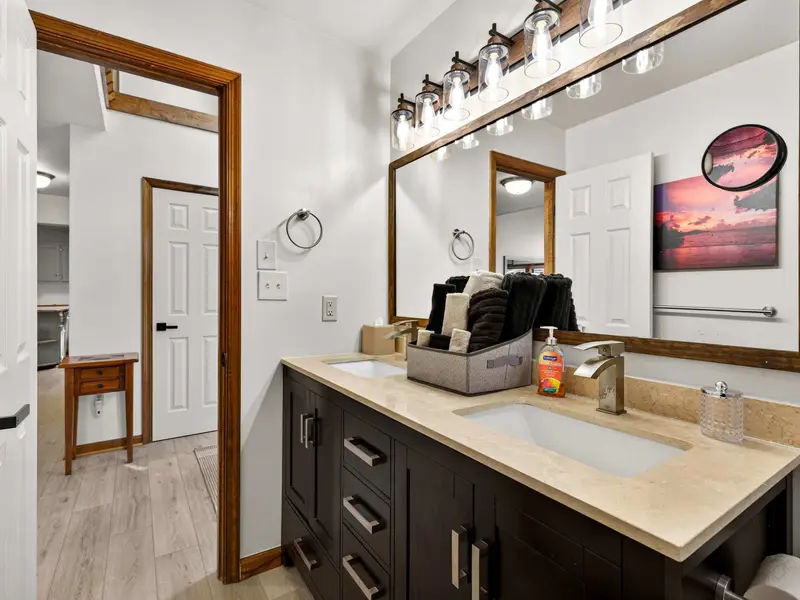 Spacious Vanities: Dark wood and granite provide a sophisticated look.