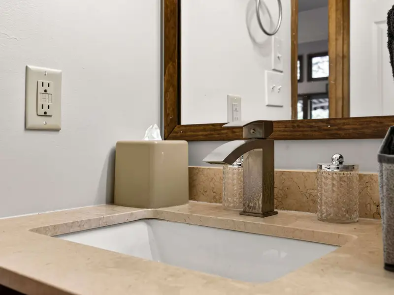 The Details: Polished hardware and rustic-framed mirrors for a touch of class.