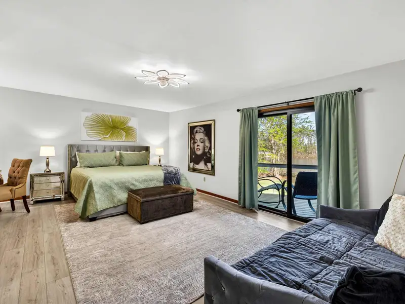 The Primary Suite: Your King-sized sanctuary with soothing sage-green tones.