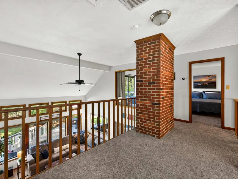Sun-Drenched Hallway: Clerestory windows keep the upper level bright all day.