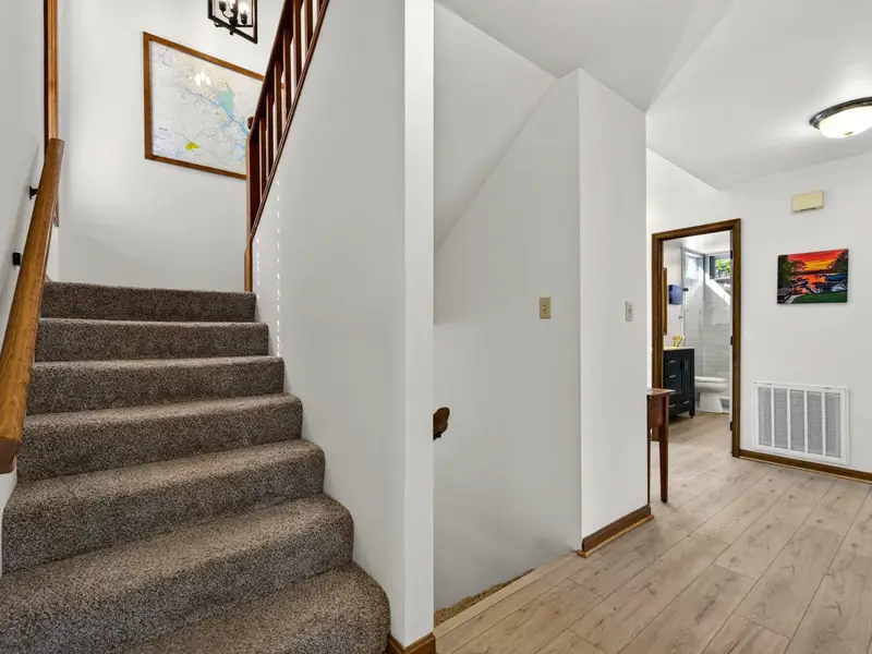 Down to the Fun: Head downstairs to the game room and bunk suite.