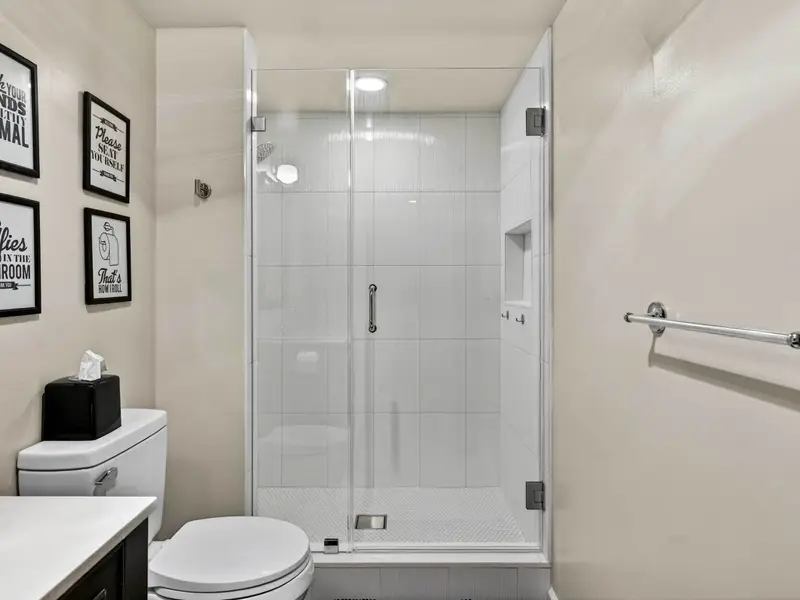 Lower Level Bath: A convenient third full bathroom serving the basement.