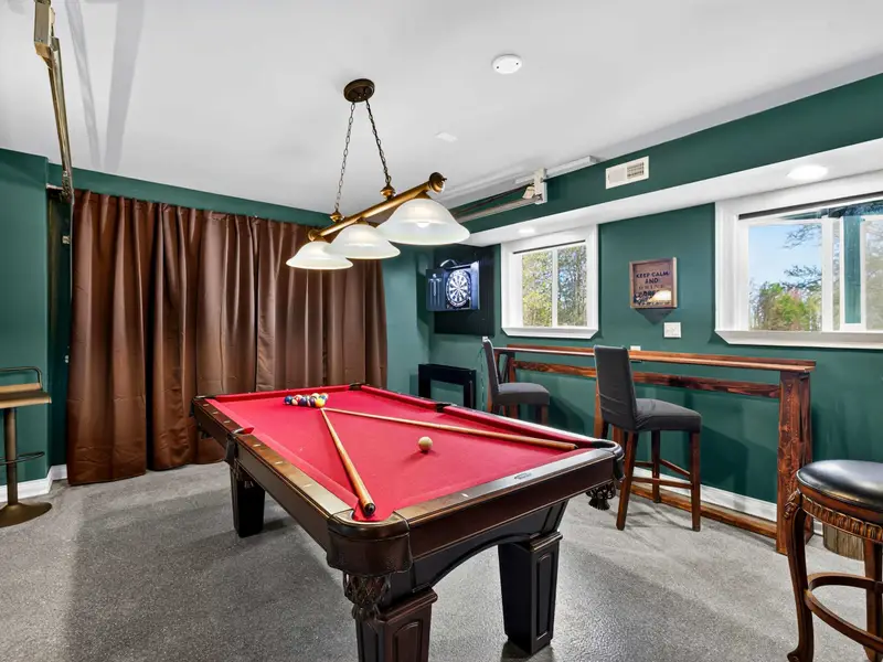 Game On: The ultimate basement hangout featuring a professional pool table.