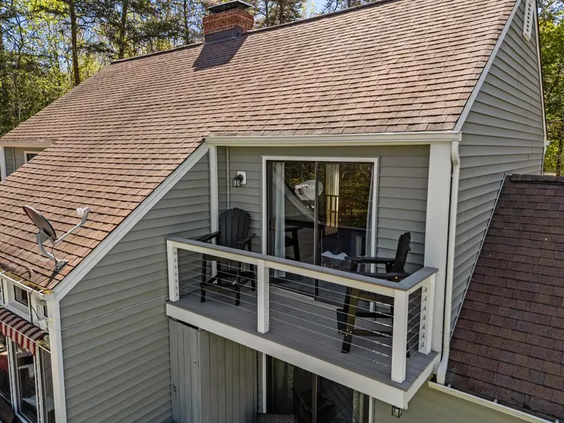 Nature All Around: Mature hardwoods providing shade and beauty.