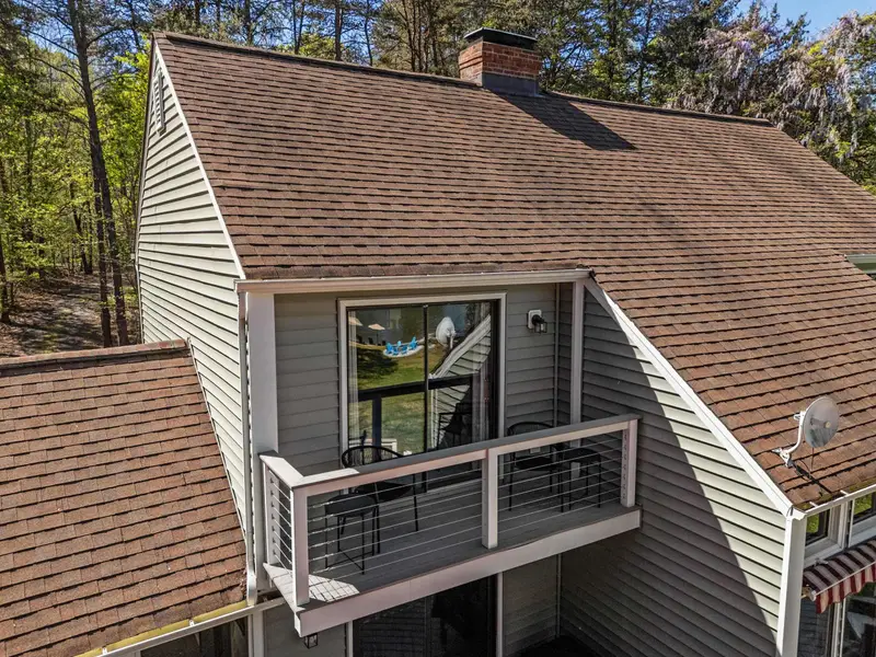 Looking Back: A view from the yard toward the home's impressive decks.