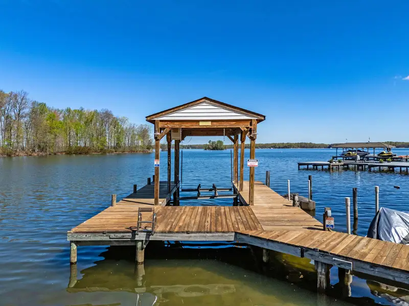 Waterfront Paradise: A wide-angle look at the property from the lake.