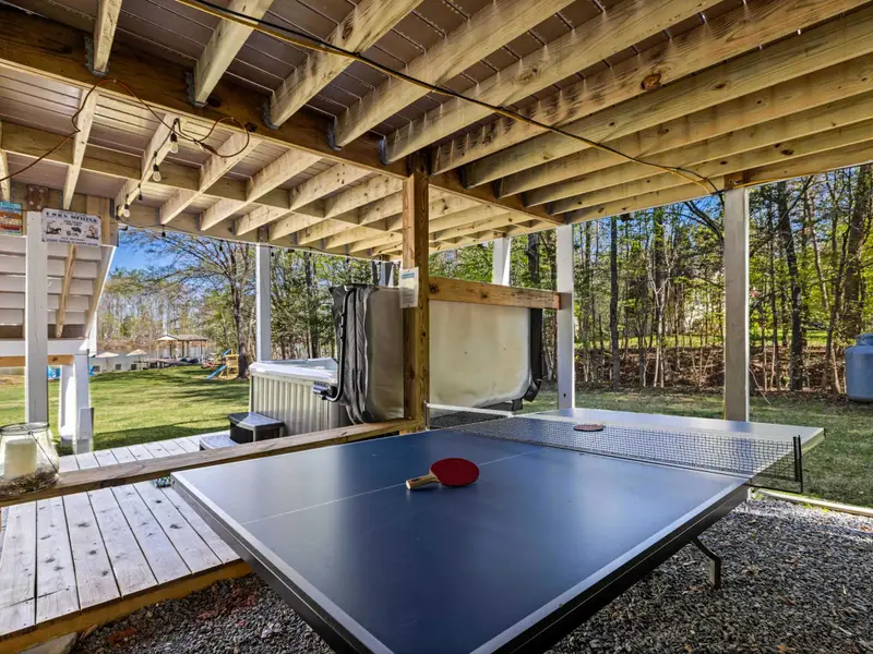 Ping-Pong Zone: Covered outdoor play under the deck, rain or shine!