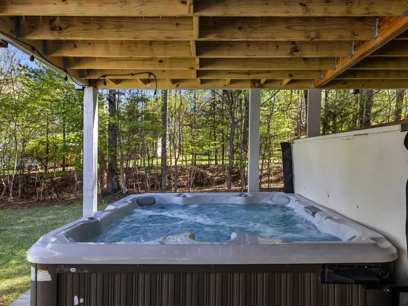 All-Season Relaxation: Enjoy the bubbles while looking out at the yard.
