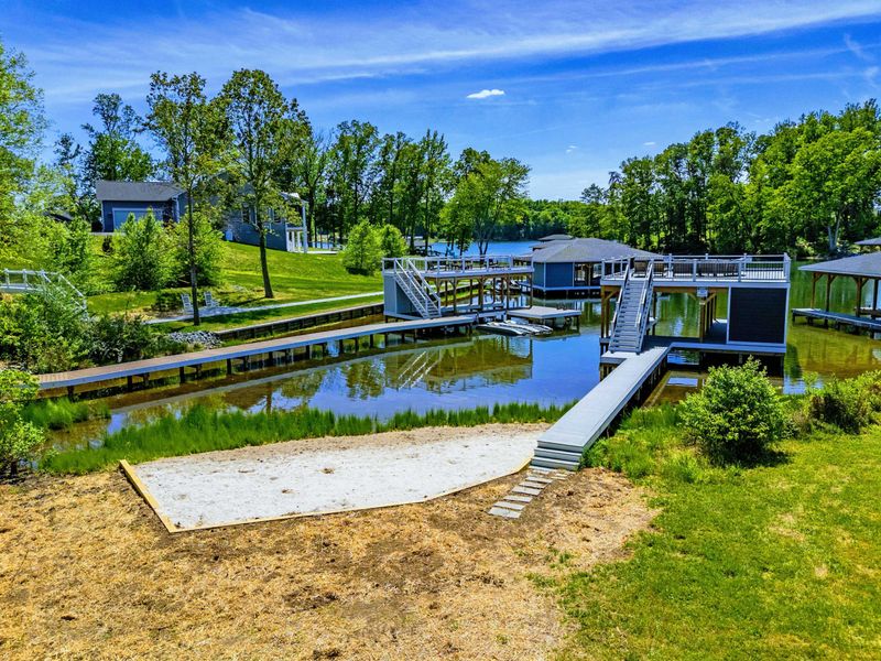 Backyard & Beach - Dock, boathouse, and private beach all meeting in one frame, with Lake Anna stretching out beyond.
