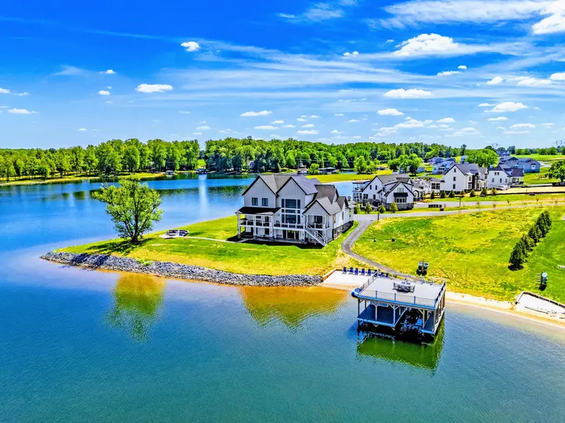 Backyard & Beach - A different angle on the property's reach: long water frontage, dock at the tip of the point.