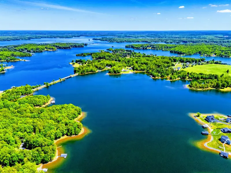 Exterior - Bird's-eye view of the cove and the surrounding lakefront community. Mostly water, mostly trees.