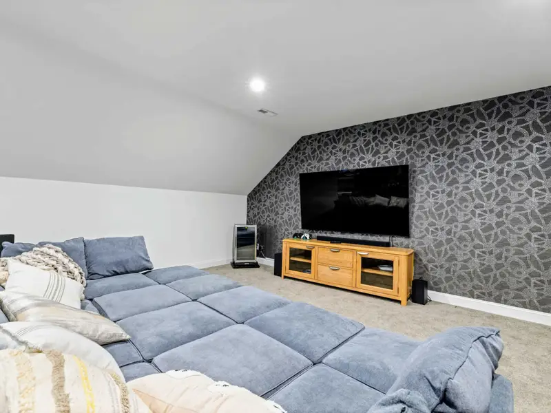 Game Room Lounge - Big TV, oversized modular sectional, and mood lighting for when the games wind down.