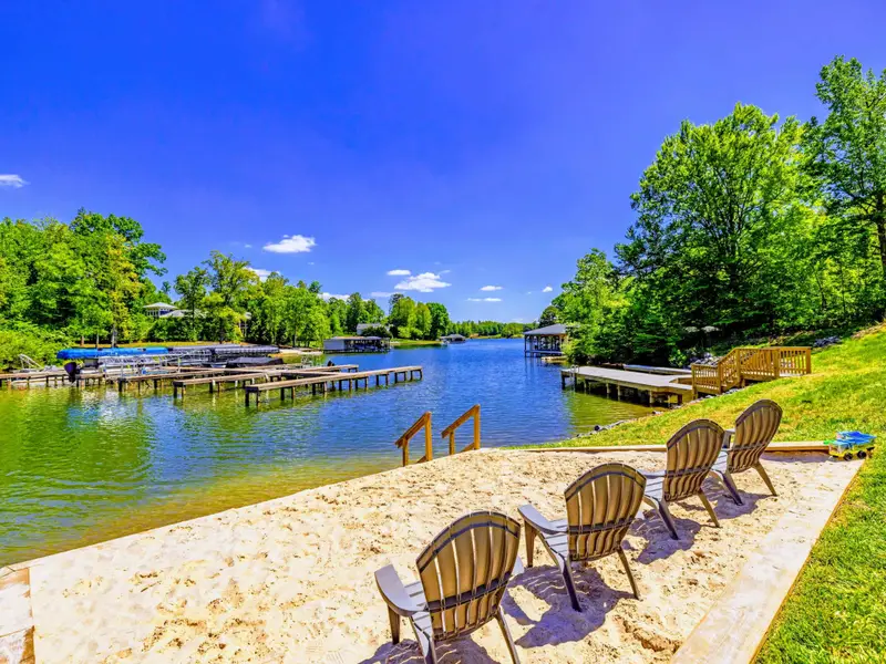 Private Beach - Adirondack chairs in the sand, the cove just steps away, and the dock ready when adventure calls.