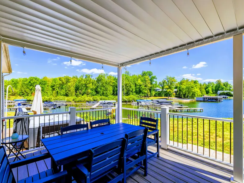 Back Porch - Blue dining set under the louvered pergola, marina and cove views straight ahead.