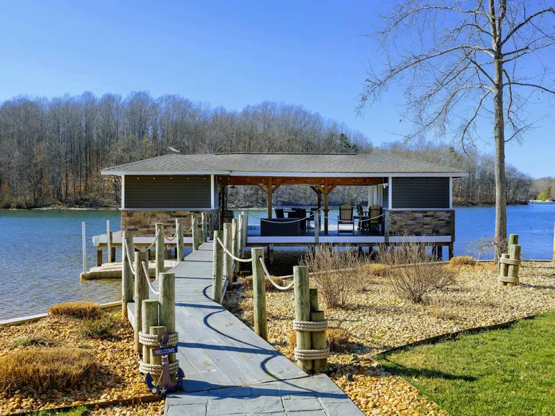 Backyard - The waterfront opens up behind the home, room to spread out and easy access to the lake.