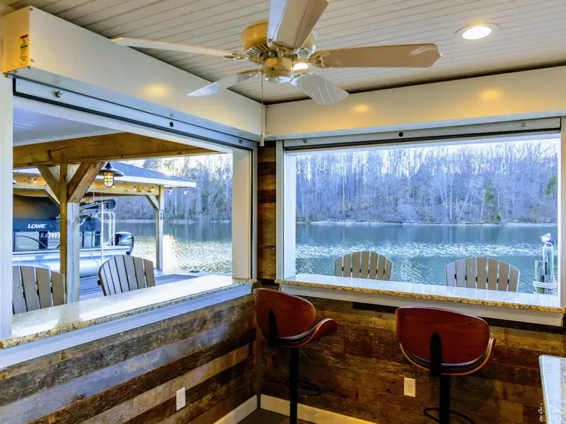 Backyard - Lakefront orientation captures soft morning light and golden sunsets across the cove.