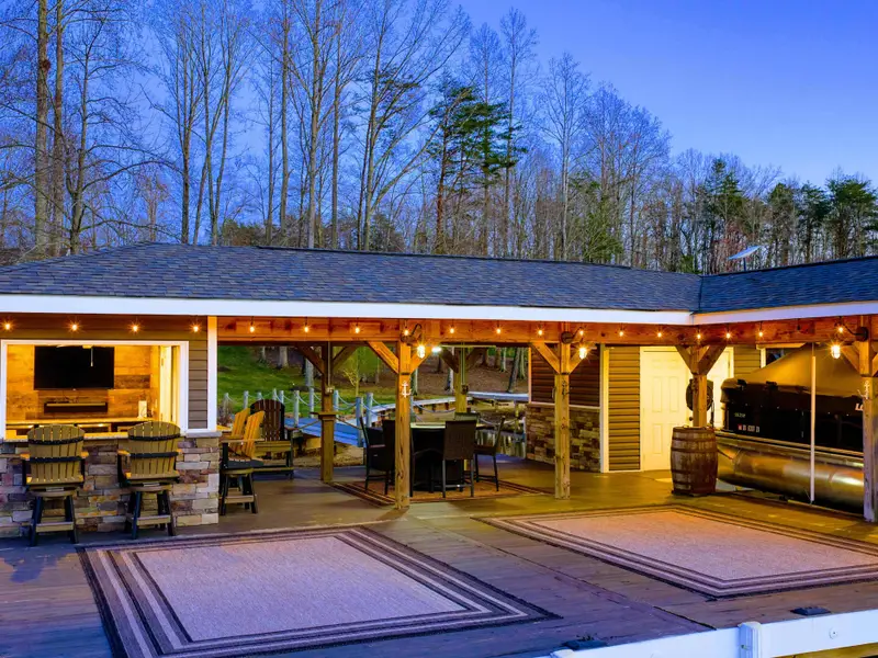 Backyard - Lakefront orientation captures soft morning light and golden sunsets across the cove.