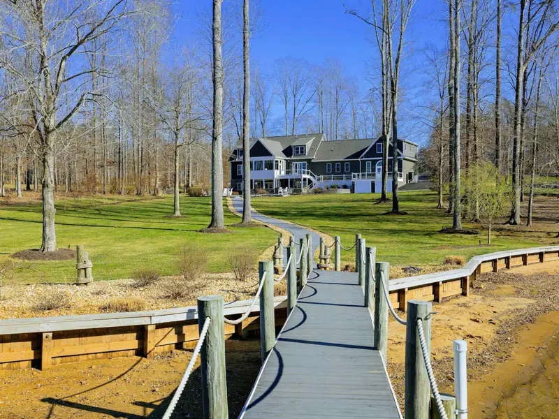 Backyard - A long sloped lawn runs from the house down to the dock and waterfront, plenty of room to spread out along the way.
