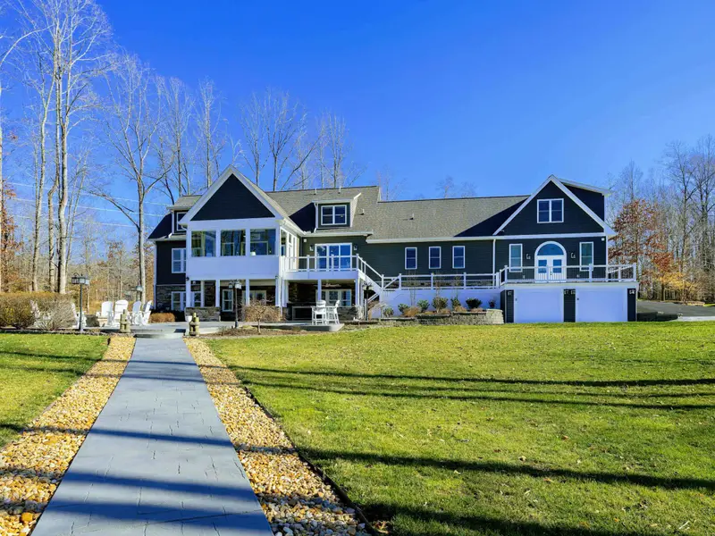 Backyard - A long sloped lawn runs from the house down to the dock and waterfront, plenty of room to spread out along the way.