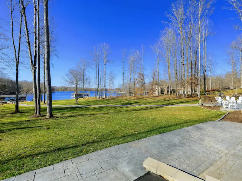 Patio - Lower-level patio access steps out to the lawn and the lake, just beyond.