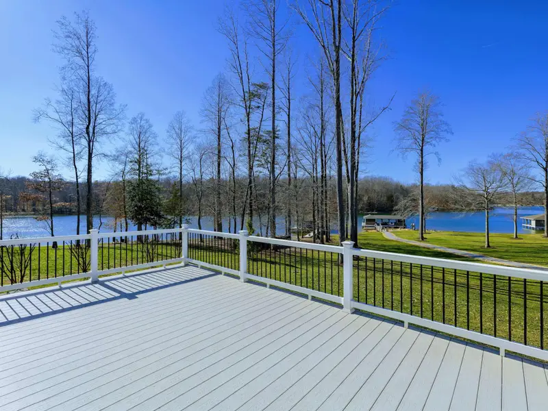 Deck - The main outdoor gathering space, with sweeping lake views and easy flow from the great room.