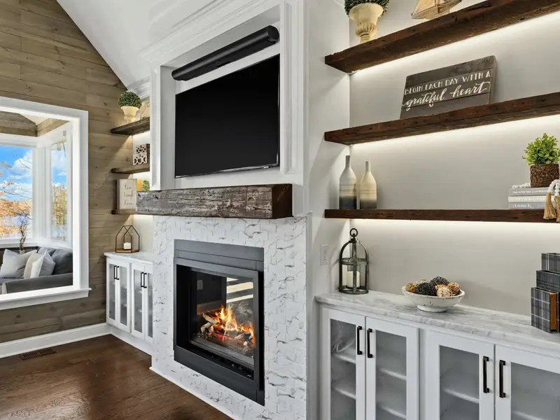 Great Room - Vaulted ceilings and walls of windows frame the lake, keeping the whole group connected.