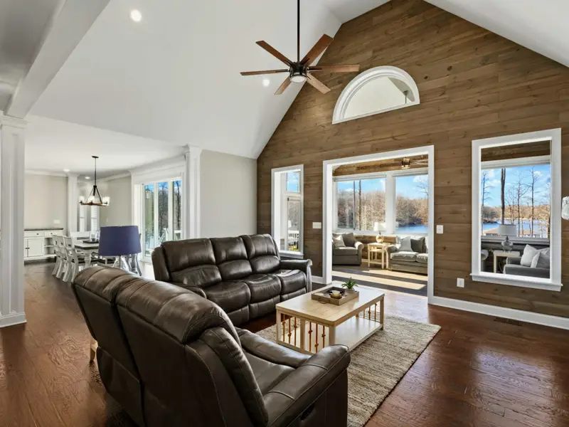 Great Room - Open floor plan with comfortable seating, a gas fireplace, and uninterrupted lake views.