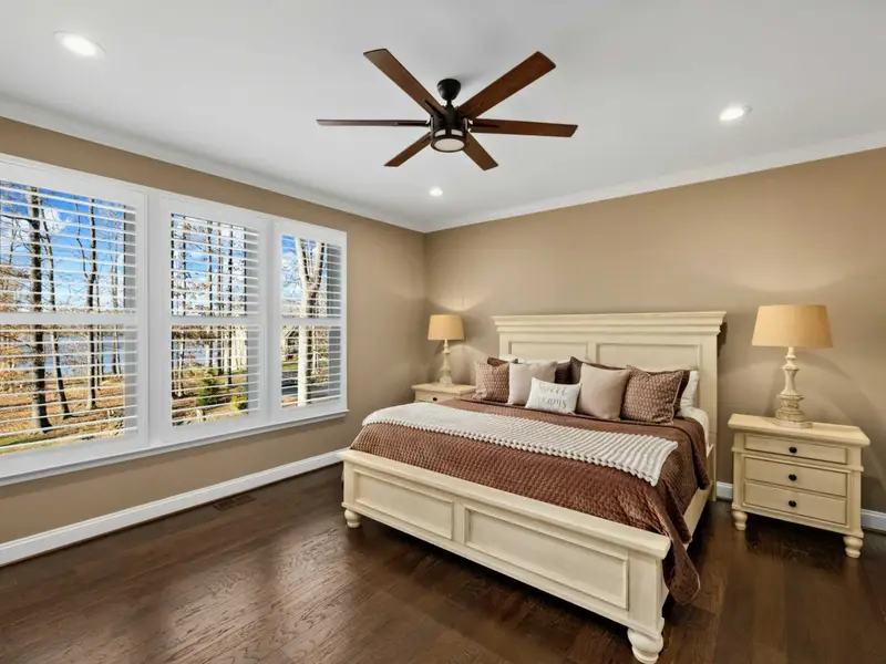 Primary Suite - King bed and private ensuite on the main level, the reward at the end of a full day on the lake.