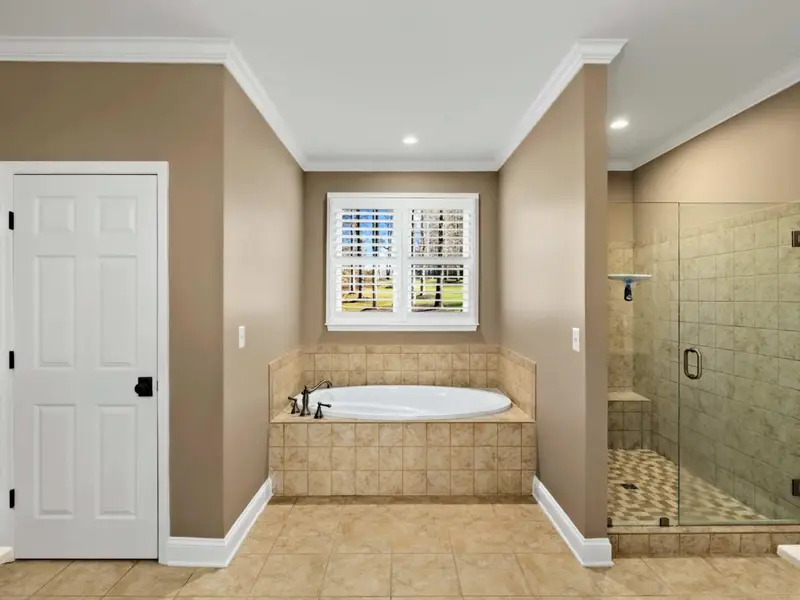Primary Suite - Walk-in closet and spa-style bath turn the morning routine into part of the stay.