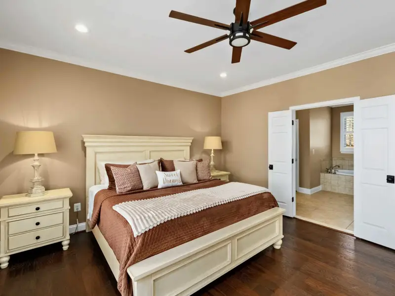 Primary Suite - Soft light and lake-view windows make this the quiet anchor of the home.
