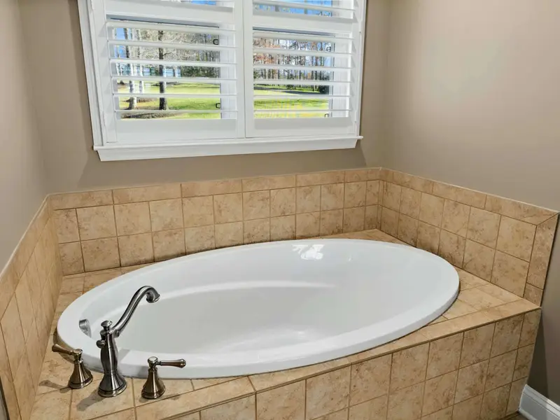 Primary Suite - Comfortable bed, generous storage, and a private retreat steps from the great room.