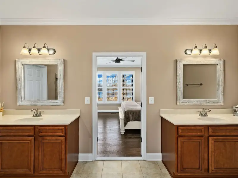 Primary Suite - Single-level access to the main living spaces, with an attached bath designed for an easy reset.