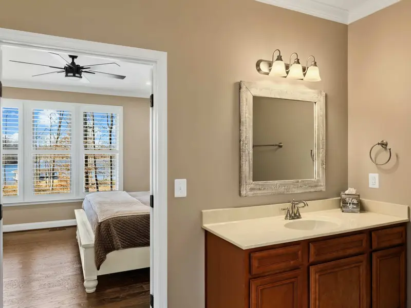 Primary Suite - Soft light and lake-view windows make this the quiet anchor of the home.