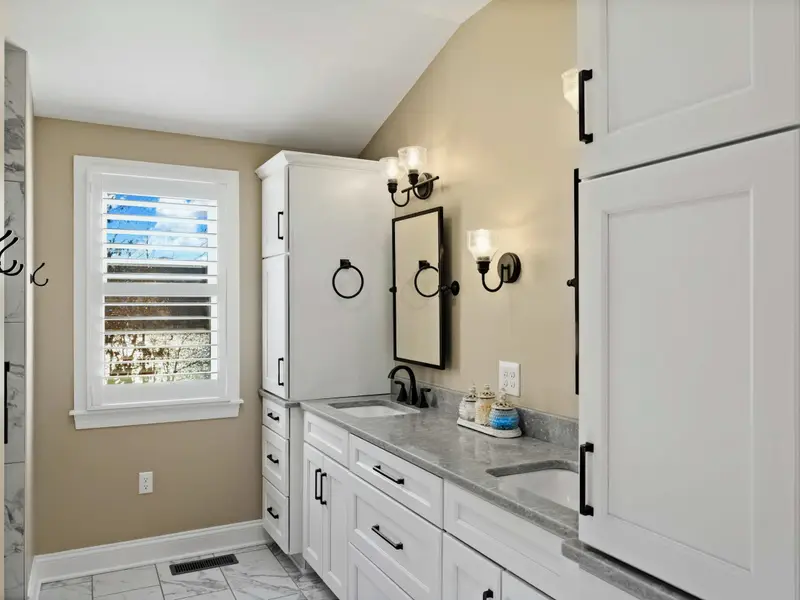Upper Level Bedroom - Comfortable bed with private ensuite, designed for restful nights after a full day outdoors.