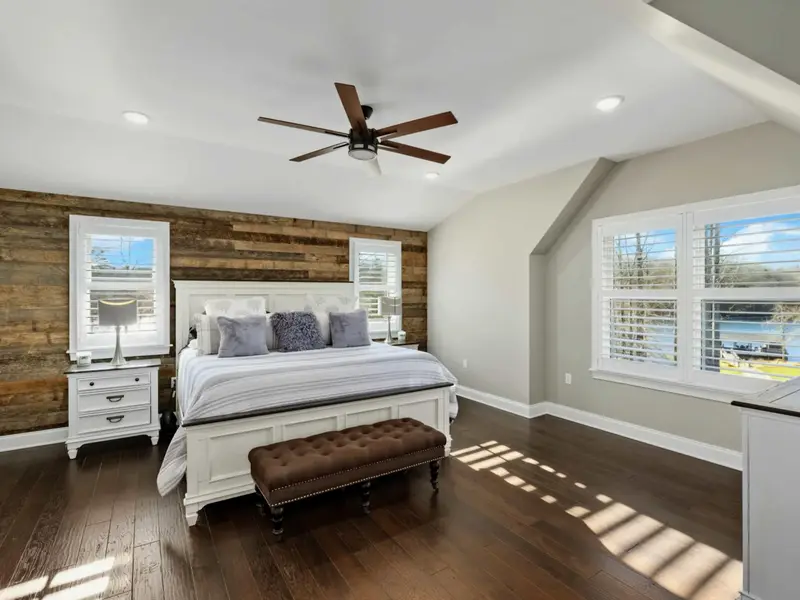Upper Level Bedroom - Comfortable bed with private ensuite, designed for restful nights after a full day outdoors.