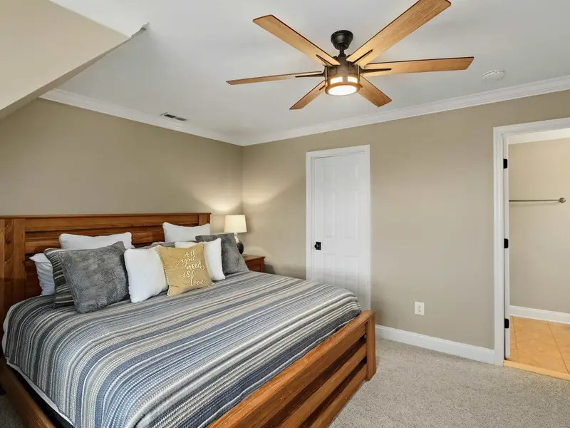 Upper Level Bedroom - Soft finishes, generous bed, and an easy-access bath.