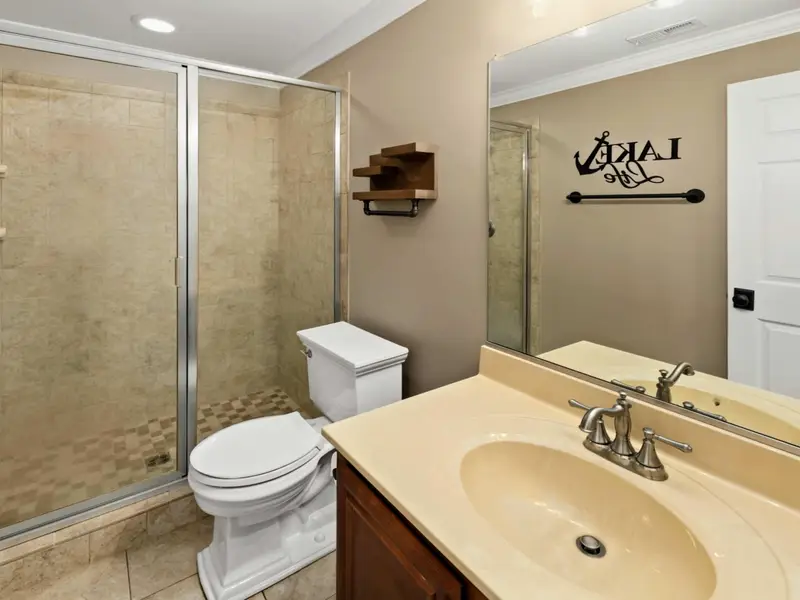 Lower Level Bedroom - Comfortable bed and private bath at the walkout level, just steps from the patio.