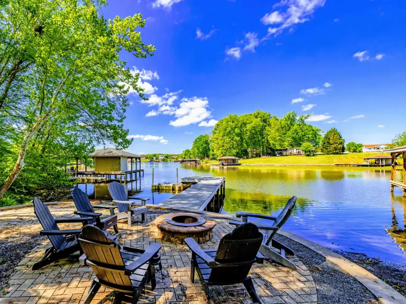 Backyard - Wooded path winds gently down to the private dock and quiet cove.